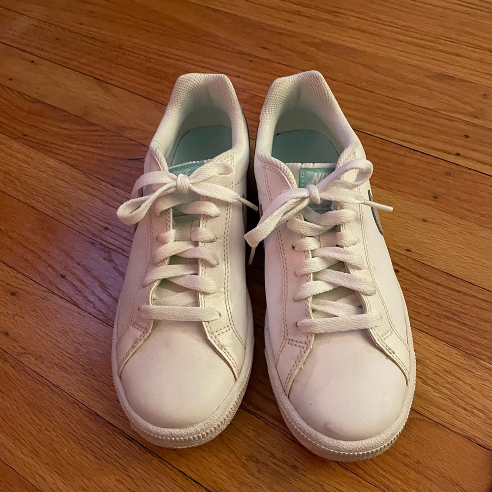 Nike white leather sneakers with gray swoosh